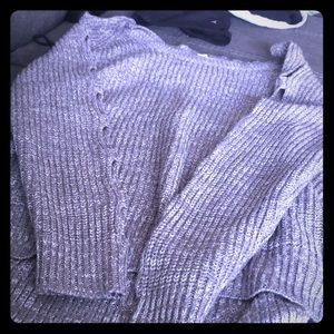 Grey shirt with holes down arm